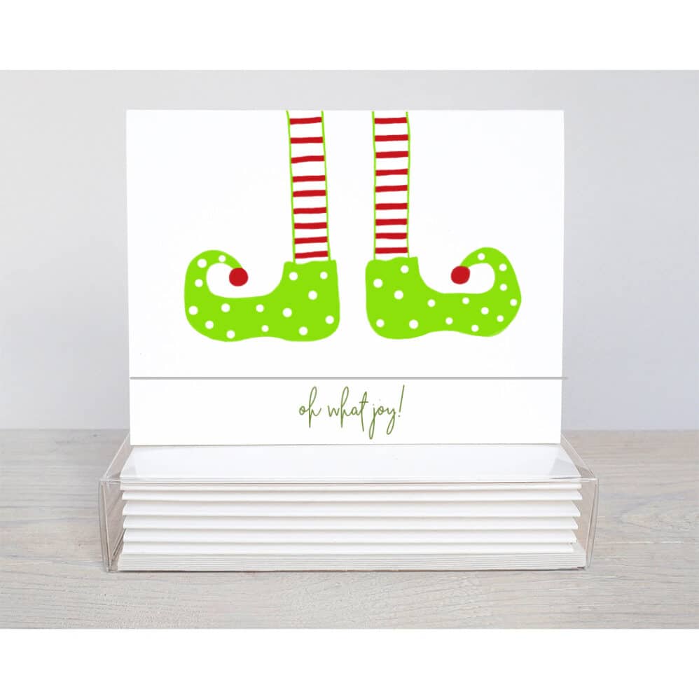 ELF LEGS HANGING from the too of the holiday note card with the words, oh what joy! seen on the inside and outside of the card.