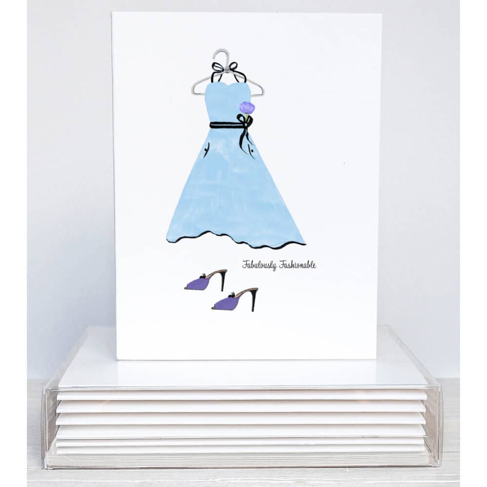 A blue dress on a hanger with purple high heels make this fabulously fashionable note card