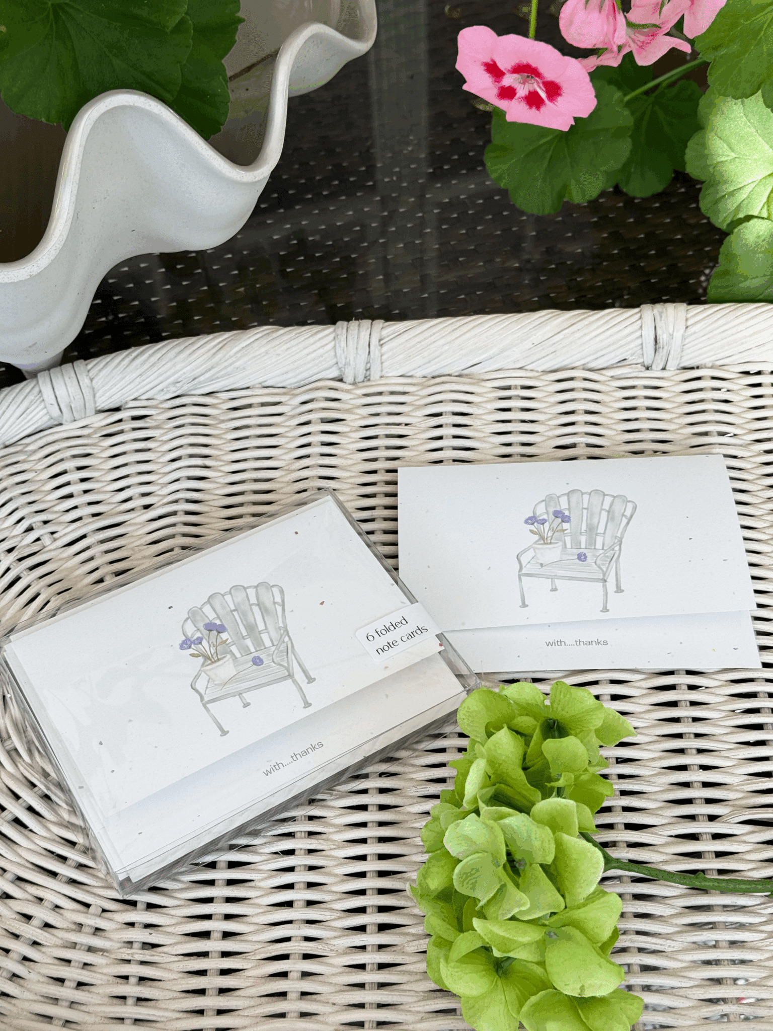 garden chair with flowers cards staged
