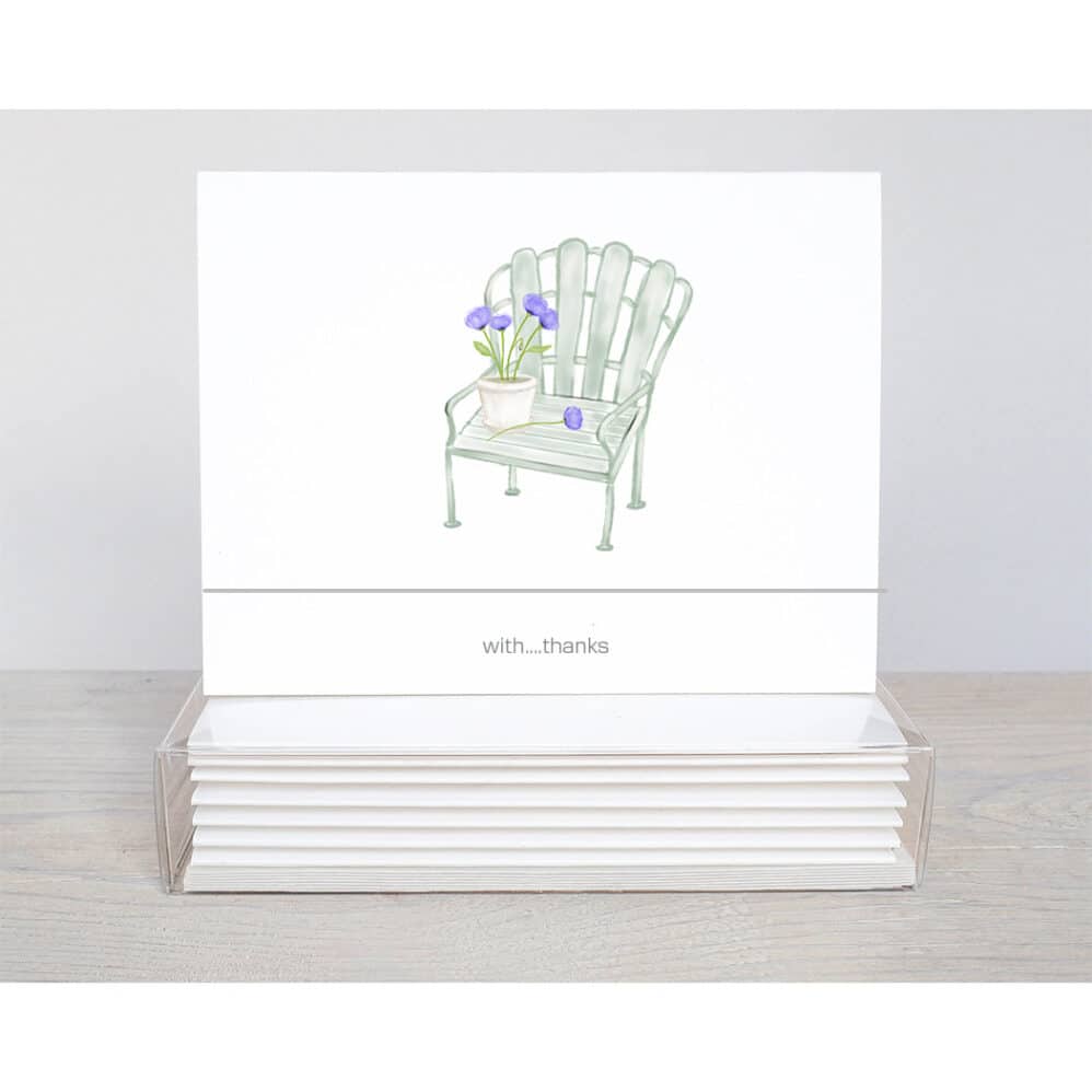 An old fashipm garden chair with purple allium in a flower pot sitting on the seat of a thank you note card