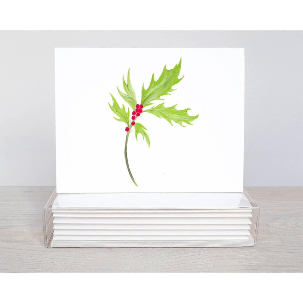 a simplistic spring of holly on a note card