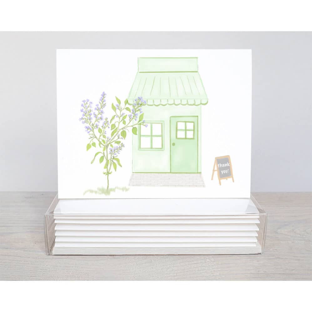 A light green little general store thank you note card with a chalk board that says thank you