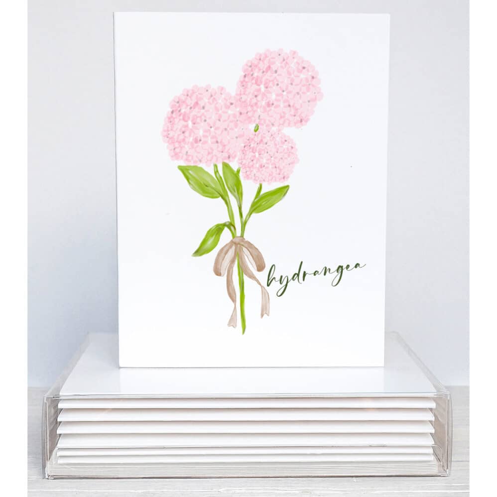 A bouquet of pink hydrangea tied with ribbon on blank note cards